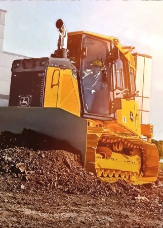 a crawler dozer pushing dirt